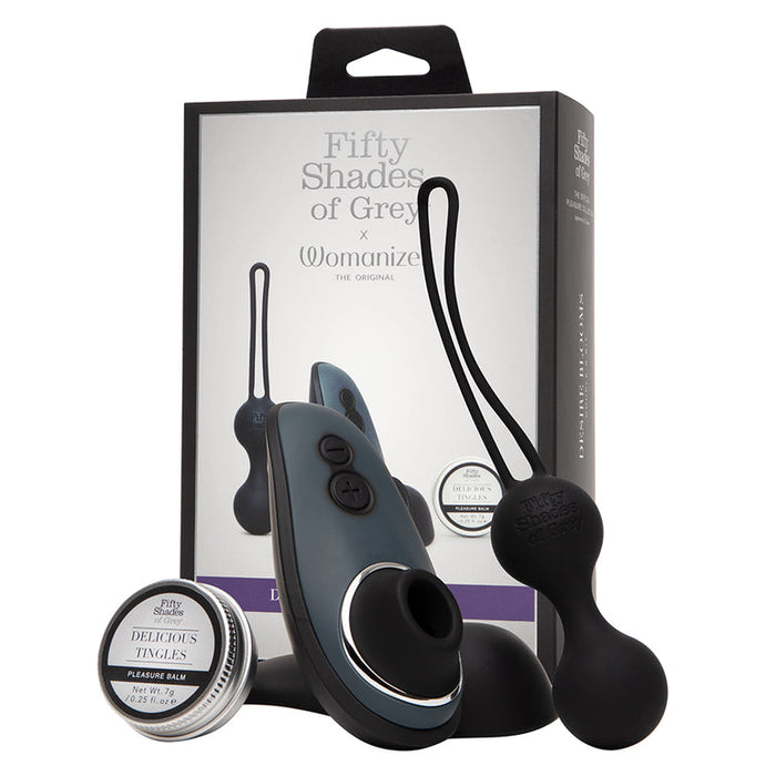 The Fifty Shades of Grey Desire Blooms Kit is a luxury couples set with the Womanizer Liberty for intense clitoral pleasure, black silicone kegel balls, sensual balm, and elegant packaging showcasing all included items.
