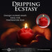 A pair of hands holds a lit, red Flaming Rose Drip Candle. Text above reads, "Dripping Ecstasy," emphasizing its unique rose shape and suitability for wax play or erotic sensations. An inset shows a close-up of the unscented candle.