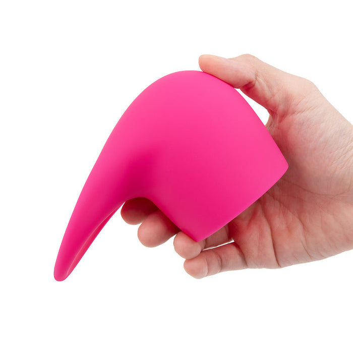 A hand holds the Flick Oral Sex Simulating Flexible Silicone Wand Attachment, a bright pink, curved, silicone accessory with a pointed tip for intense clitoral stimulation, against a white background.