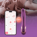 A woman lies smiling with her eyes closed on a bed. In front, a smartphone shows the Fling Powerful Licking Vibrator with App Control’s pink interface, highlighting Bluetooth connectivity between the device and the app.