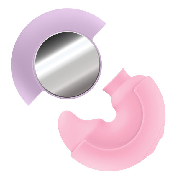 The Pout & Play Double Ended Vibrator with Licking Tongue features lavender and pink crescent shapes, one with a round mirror, the other grooved—both sleek and discreet for clitoral stimulation.