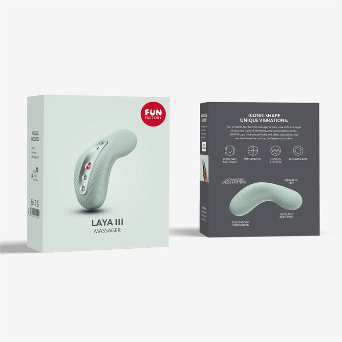 The image shows the front and back of a product box for the "Fun Factory Laya 3 Lay On Humping Vibrator - Sage Green." The front features an image of the massager along with its name, while the back highlights its ergonomic design, body-safe silicone construction, customizable vibrations, waterproof build, and rechargeable nature.