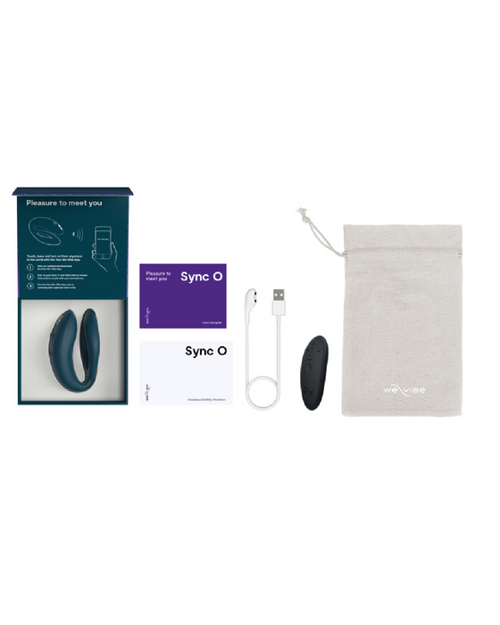 A We-Vibe display showing a We-Vibe Sync O Hands-Free Wearable Couples Vibrator - Green with its packaging, charging cable, remote control, and storage pouch.
