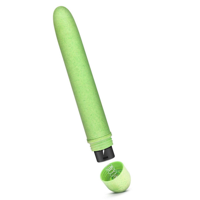 A green eco-friendly Gaia Biodegradable, Recyclable Eco Vibrator by Blush with its cap removed and placed below the pen. The vibrator, made from Biofeel bioplastic, reveals a visible spring mechanism inside and has a smooth, slightly textured surface.