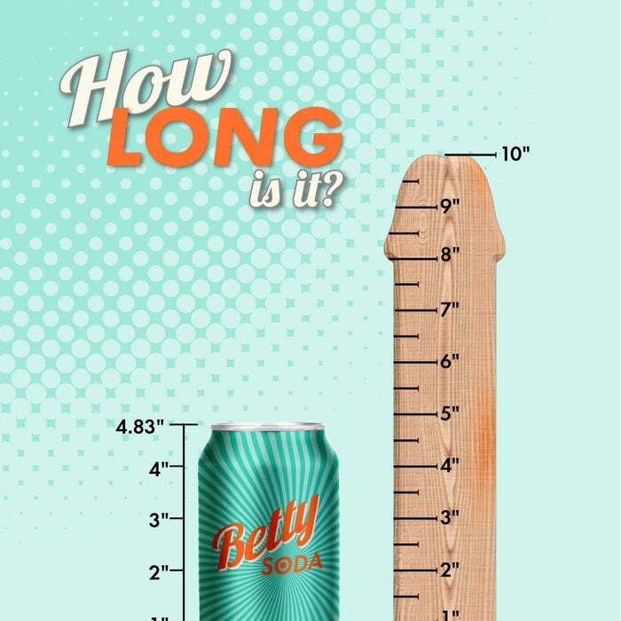 A comparison between a Glas Girthy Realistic Clear Glass 10.5 Inch Double Dildo and a wooden ruler showing the dildo's length at approximately 4.83 inches on a playful dotted teal background.