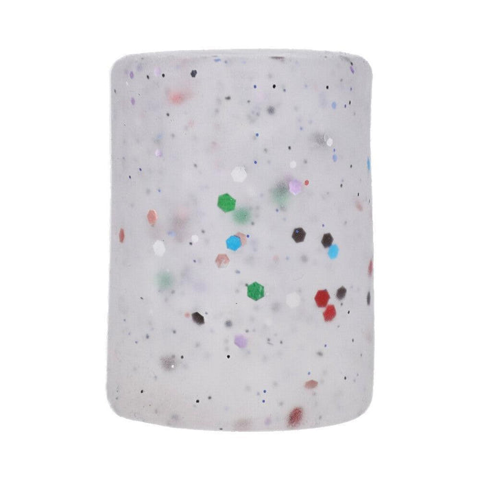 A cylindrical, translucent white design adorned with scattered multicolored specks and featuring green, red, and purple hexagons on its surface, set against a plain white background to emphasize the vibrant style of the Doc Johnson GoodHead Birthday Blowjob Kit - Stroker + Birthday Cake Slick Head Glide.