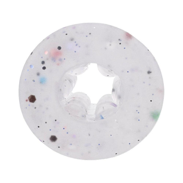 A round, transparent item from the GoodHead Birthday Blowjob Kit by Doc Johnson features a slick surface adorned with red, blue, black, and green speckles and a star-shaped hole at its center—ideal for those who enjoy the Stroker experience.