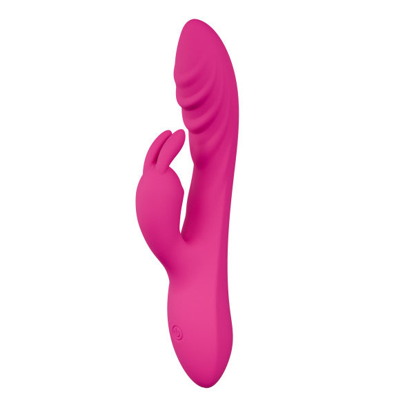 The Wild Lust Slim Beginner G-Spot Rabbit Vibrator is a bright pink silicone toy with a curved, ribbed shaft for G-spot stimulation and a petite rabbit-shaped clitoral stimulator at the base for dual pleasure.
