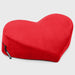 The Liberator Heart Wedge Sex Positioning Cushion, a plush red heart-shaped pillow with a black zipper and tag, rests on a light gray background—ideal for stylish sex furniture or as a playful G-spot pillow.
