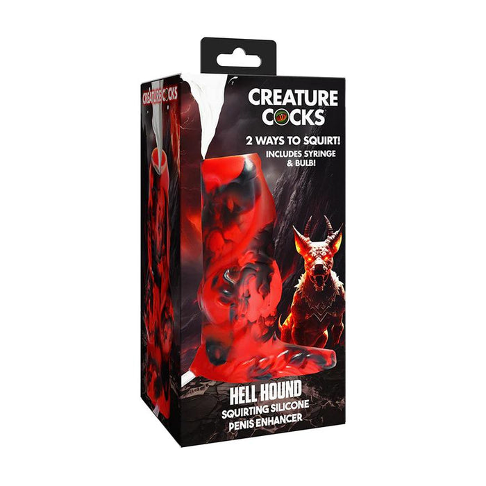 A box labeled "Hell Hound Canine Squirting Penis Enhancer" features a fiery red and black fantasy design with a demonic hound illustration, highlighting this unique toy plus included syringe and bulb.
