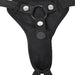 Close-up of a Sportsheets black adjustable harness showing the waist belt, leg loops, and belay loop with brand logos on the fastenings.