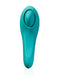 A teal-colored, oval-shaped wearable device with a smooth silicone surface and a rounded, raised button in the center. The minimalist, futuristic design features a gently curved bottom, embodying Hot Octopuss's sleek aesthetics. The Hot Octopuss Pulse Queen Oscillating Waterproof Vibrator is set against a plain white background.