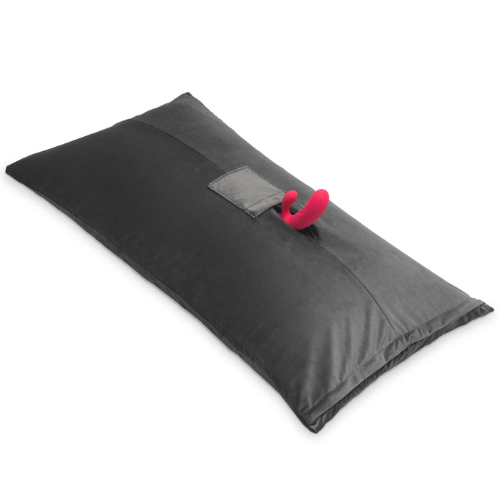 The Liberator Humphrey Pillow-Style Sex Toy Mount is a large, rectangular black ergonomic pillow with a central pocket that securely holds your favorite toys for versatile and hands-free pleasure.