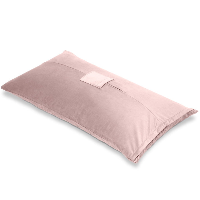 The Liberator Humphrey Pillow-Style Sex Toy Mount is a rectangular, light pink, velvety pillow with a small top pocket for hands-free use, shown against a white background.