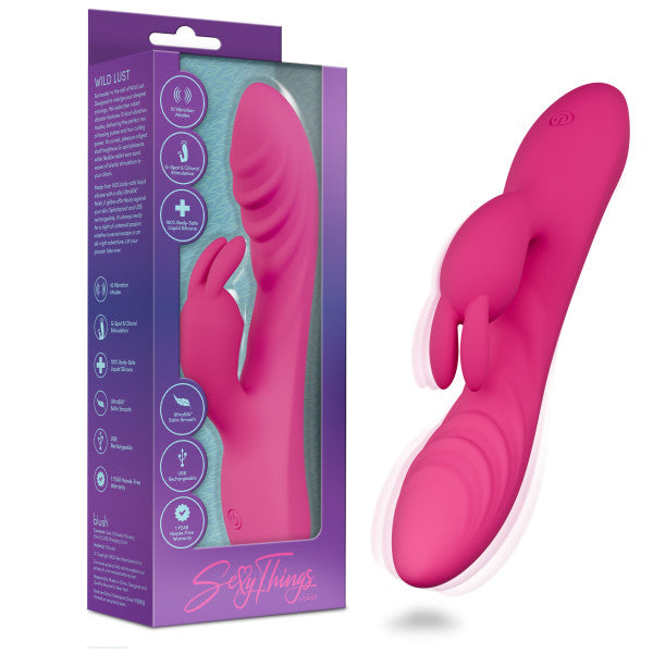 The Wild Lust Slim Beginner G-Spot Rabbit Vibrator in pink silicone is shown beside its "Sexy Things" packaging. Its curved design and playful rabbit-shaped stimulator target both G-spot and clitoral pleasure.