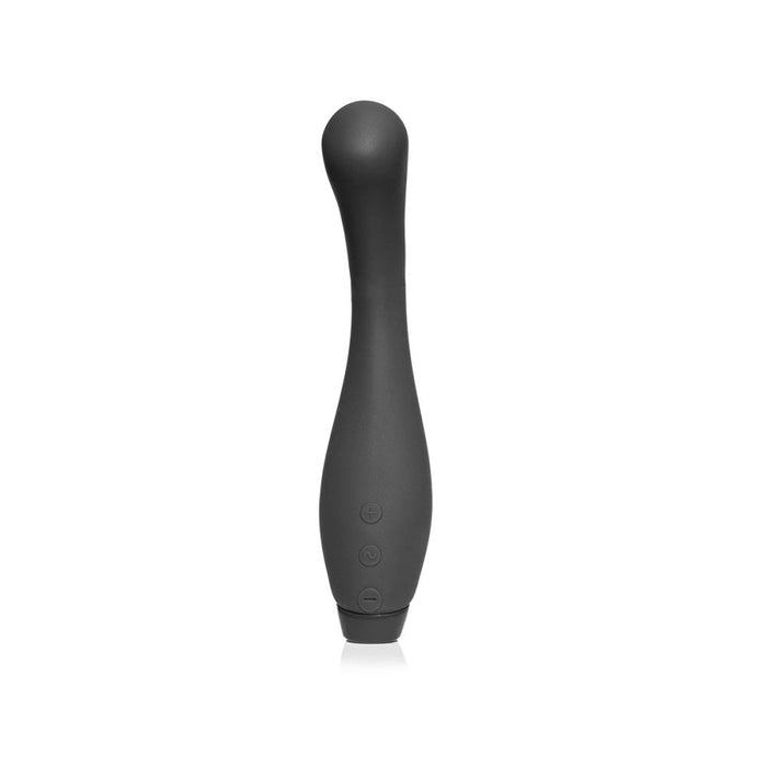 Introducing the Je Joue Juno Flex G Spot Vibrator - Black by Je Joue: a sleek, black, battery-operated personal massager with a curved, elongated design. This flexible vibrator features a rounded tip and three control buttons along the lower portion. It is displayed standing upright against a white background.