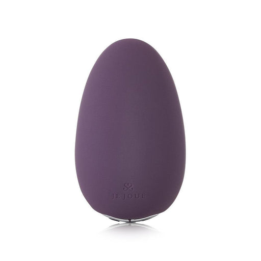 The Je Joue Mimi Clitoral and External Vibrator in purple is an egg-shaped personal massager with a smooth surface and a small base. The brand name "Je Joue" is engraved near the bottom. This USB rechargeable device has a simple, modern design, offers multiple vibration speeds, and appears to be made of silicone.