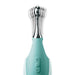 A close-up of the Jimmyjane Focus Pro Pinpoint Tip Clitoral Vibrator by Pipedream Products showcases its sleek, modern design. The turquoise vibrator features a silver neck and two interchangeable head attachments. The handle flaunts a power button and plus-minus buttons for adjustable settings. Sonic vibrations are evident through the motion blur of the vibrating tip.