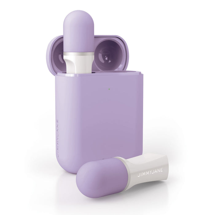 A two-bullet personal care device by Pipedream Products, featuring silicone finger grips and shown inside its matching purple charging case. The product, Jimmyjane Hello Touch Pro, has a rounded top and sleek design with the "JIMMYJANE" branding visible on its side. The open charging case displays the device inside.