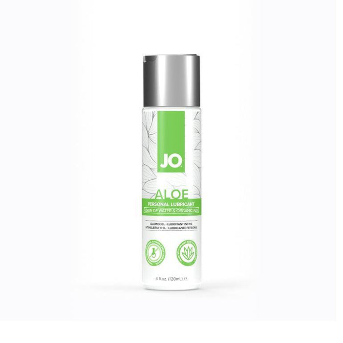 A 4 fl. oz. bottle of System Jo's JO Aloe Water Based Sensitive Skin Lubricant, featuring a silver cap and a white label with green accents. The label highlights soothing water & organic aloe and includes icons for vegan, paraben-free, pH balanced, with a leaf design in the background.