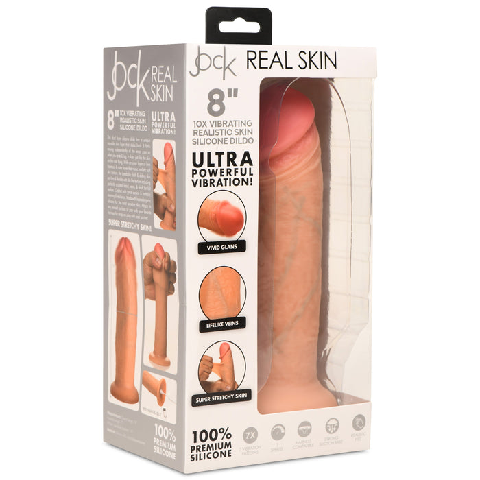 The Jock Real Skin Vibrating 8 Inch Silicone Suction Cup Dildo - Vanilla from XR Brands features a realistic dildo with a dual-density design. The packaging highlights "10x Vibrating," "Ultra Powerful Vibration," "Vivid Glans," "Lifelike Veins," and a suction cup for versatile use.