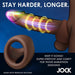 Illustration of the JOCK Silicone Cock & Ball Ring in dark skin tone at the base, with glowing rings and motion lines. Text: "Stay harder, longer," showcasing this stretchy, premium silicone ring for comfort and performance.