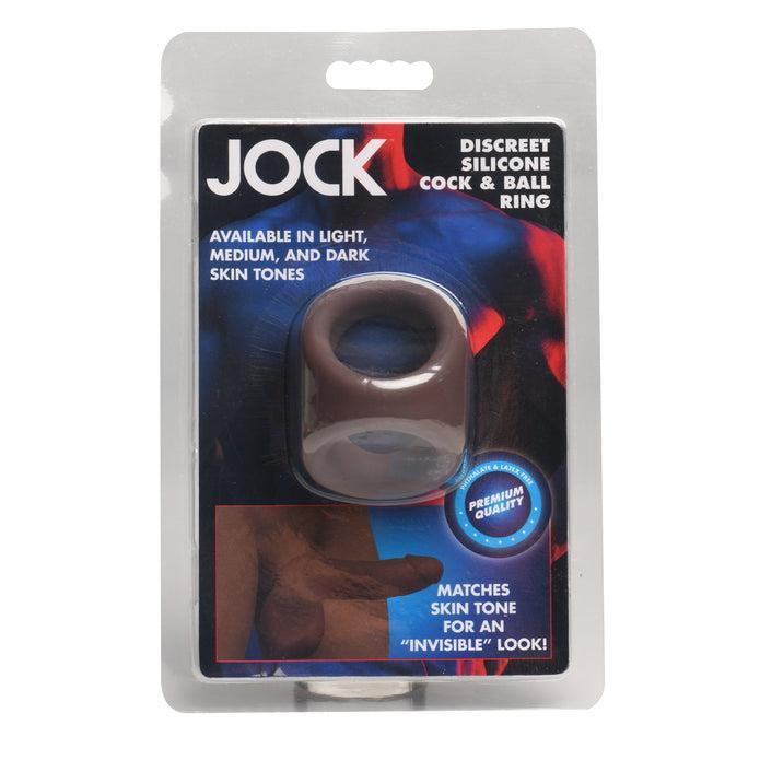 The JOCK Silicone Cock & Ball Ring Dark Skin Tone comes in discreet packaging, emphasizes its stretchy silicone build, and offers light, medium, and dark skin tone options for an "invisible" match.