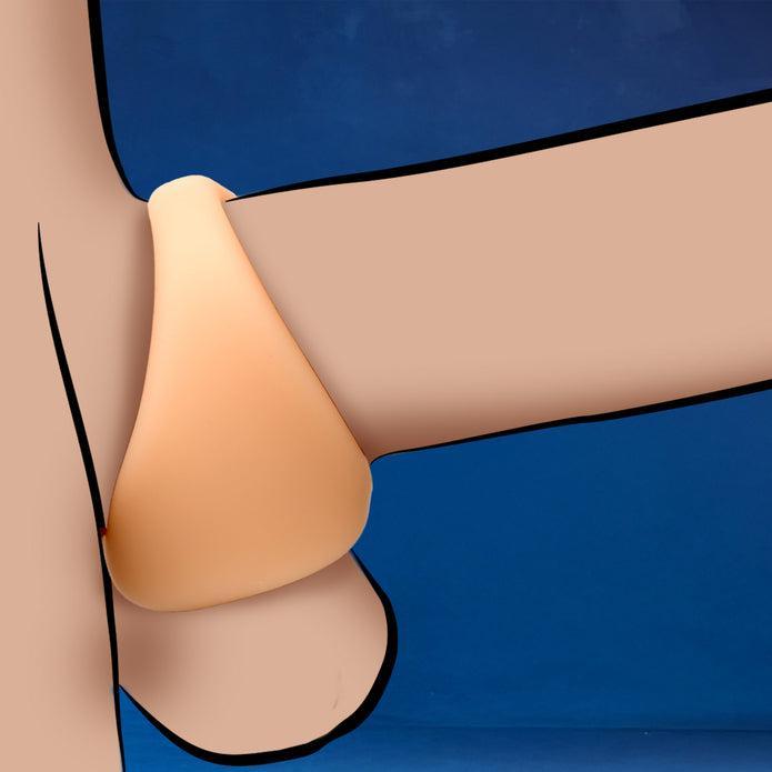 A simple, stylized illustration of the JOCK Silicone Cock & Ball Ring in light skin tone against a blue background, highlighting its ergonomic shape, smooth curve, and body-safe silicone material.