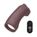 The Jock Vibrating Penis Sleeve and Support with Remote - Chocolate is a dark brown, body-safe silicone sleeve with textured buttons and an open end, shown beside a "JOCK"-labeled black remote for power and settings control.