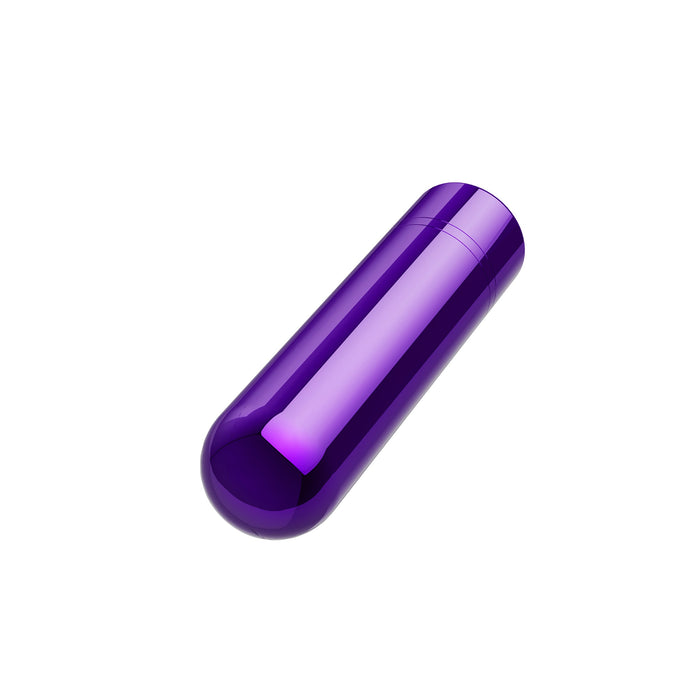 Introducing the Kool Vibes Rechargeable Mini Bullet by Blush: a glossy, purple capsule-shaped bullet vibe featuring smooth, rounded ends. Displayed against a plain white background, its shiny surface is highlighted. This USB rechargeable device offers 5 speeds for customizable pleasure.
