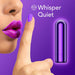 Close-up of a woman's face with vibrant purple lips and a matching purple nail on her index finger, held to her lips in a 'shh' gesture. Beside her is a shiny purple cylindrical object: the Blush Kool Vibes Rechargeable Mini Bullet. The text "Whisper Quiet" is displayed at the top on a purple background.