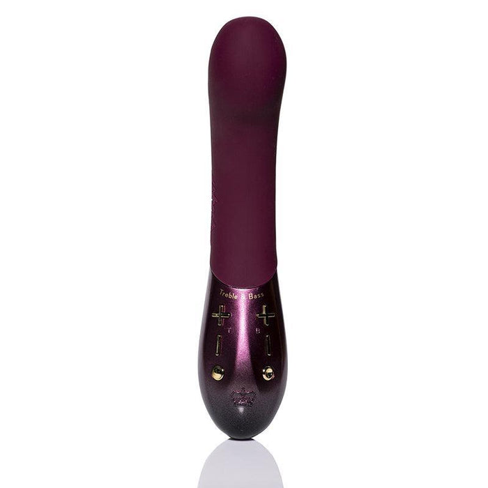 A dark purple Kurve Dual Motor G-Spot Vibrator by Hot Octopuss stands upright on a white background. The device features a rounded, smooth top and a slightly shiny lower half, complete with gold-colored plus and minus buttons for control.