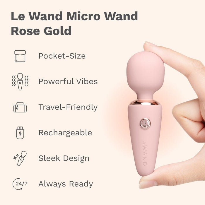 A hand holds the Le Wand Micro Powerful Pocket Sized Wand in pink. Features include deep rumbly vibrations, rechargeable, sleek and pocket-size design, travel-friendly, and always ready to use.
