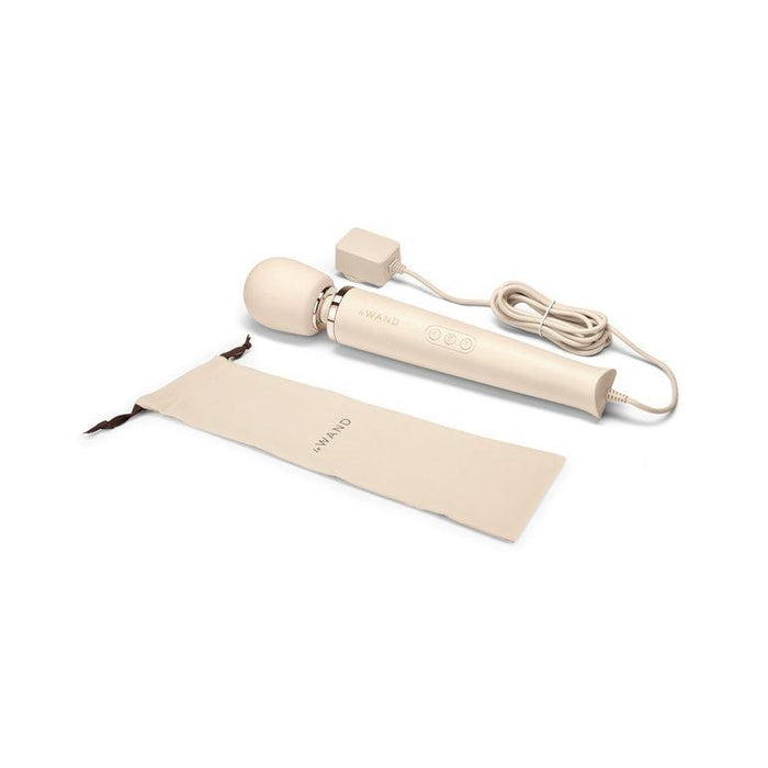 The Le Wand Plug In Powerful Wand Vibrator in Cream by Le Wand, featuring a rounded head and buttons on the handle, is displayed next to its beige zippered storage case and an extended white power cord. This powerful massager offers 10 vibration levels, all set against a plain white background.