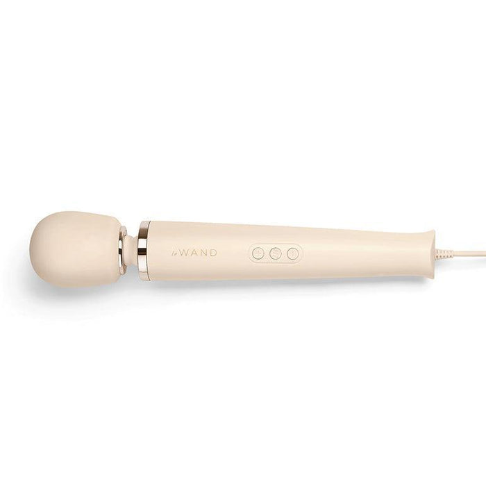 A cream-colored handheld massager from Le Wand with a rounded head and sleek handle. The handle is equipped with a power button and two control buttons, allowing for 10 different vibration levels. The product name "Le Wand Plug In Powerful Wand Vibrator" is etched on the side, and it includes a power cord. It comes with a zippered storage case for convenience.