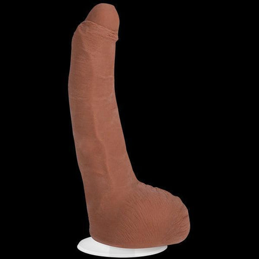 The Doc Johnson Leo Vice Uncut Vac U Lock Porn Star Dildo in Caramel is a realistic adult toy made from Ultraskyn material, designed to resemble a human penis. It stands upright on a Vac-U-Lock suction cup and features dual density construction with detailed anatomy and a veined texture for an authentic experience.