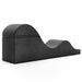 The Liberator Aria Flip Chaise Sex Lounger is a black, foam-covered ergonomic bench with a wave-like design, shown against a white background.