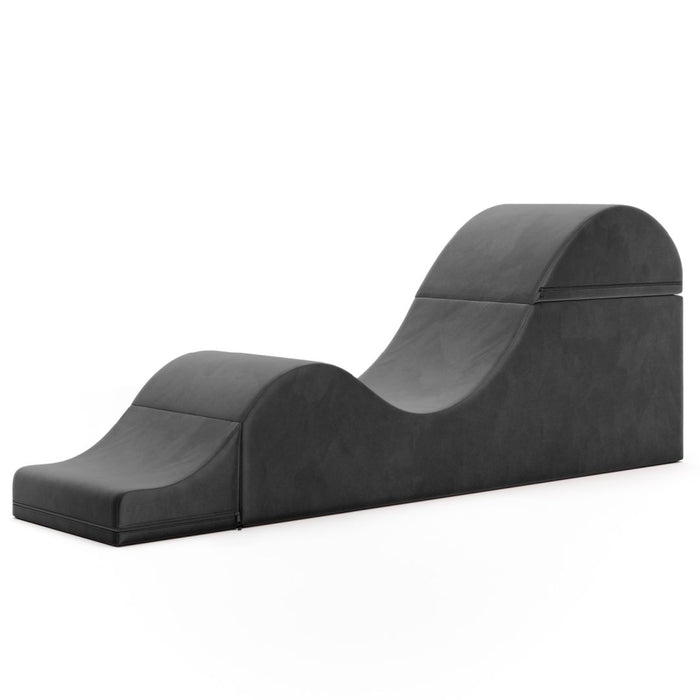 Modern Liberator Aria Chaise Sex Lounger - Black with a unique curved design on a white background.