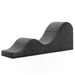 Modern Liberator Aria Chaise Sex Lounger - Black with a unique curved design on a white background.