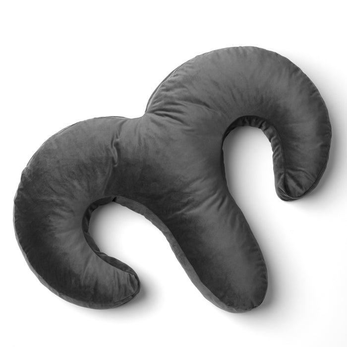 The Liberator Arie Toy Mount Snuggle Pillow features a dark gray, plush design with two curved arms and a central body, shaped like an abstract "M," and includes two discreet vibrator pockets for added comfort.