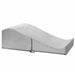 The Liberator Flip Ramp Convertible Sex Positioning Furniture is a gray, foam wedge with a gentle incline and curved top that discreetly doubles as an ottoman, providing ergonomic support and comfort. Shown here with a soft fabric cover on a white background.