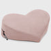 The Liberator Heart Wedge Sex Positioning Cushion is a soft, light pink, heart-shaped pillow with a side zipper, shown lying on a plain light background.