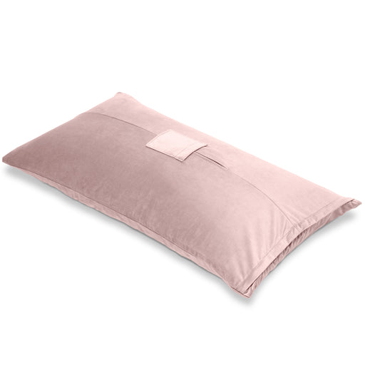 The Liberator Humphrey Pillow-Style Sex Toy Mount is a rectangular, light pink, velvety pillow with a small top pocket for hands-free use, shown against a white background.