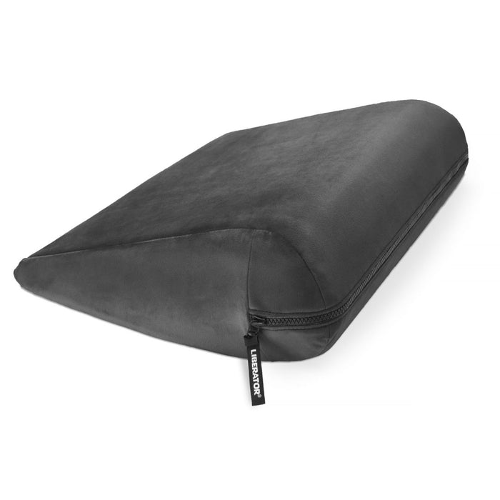The Liberator Jaz is a black wedge-shaped bedroom booster cushion with a zippered cover and a small tag near the zipper. It’s perfect as a discreet sex position pillow, providing added comfort and support during intimate moments.
