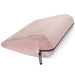 The Liberator Jaz – Discreet Positioning Support Cushion is a light pink, wedge-shaped pillow with a soft velvety texture and side zipper, featuring a black Liberator tag—ideal as a stylish and comfortable bedroom booster.