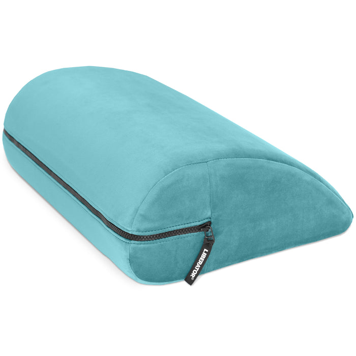 The Liberator Jaz Motion – Dual-Sided Rocking Positioning Cushion is a teal, wedge-shaped memory foam pillow with a visible zipper and "KZKR&DRP" tag, designed to provide rocking support and enhanced comfort during use.