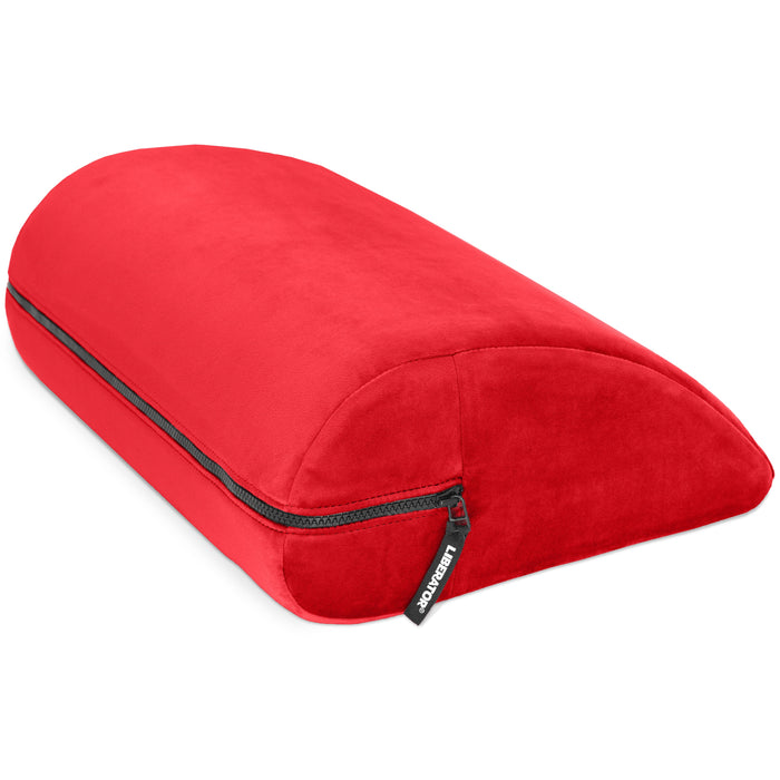 The Liberator Jaz Motion – Dual-Sided Rocking Positioning Cushion is a bright red, wedge-shaped pillow with a soft cover, visible side zipper, small black label, and is designed for comfortable rocking motion support.