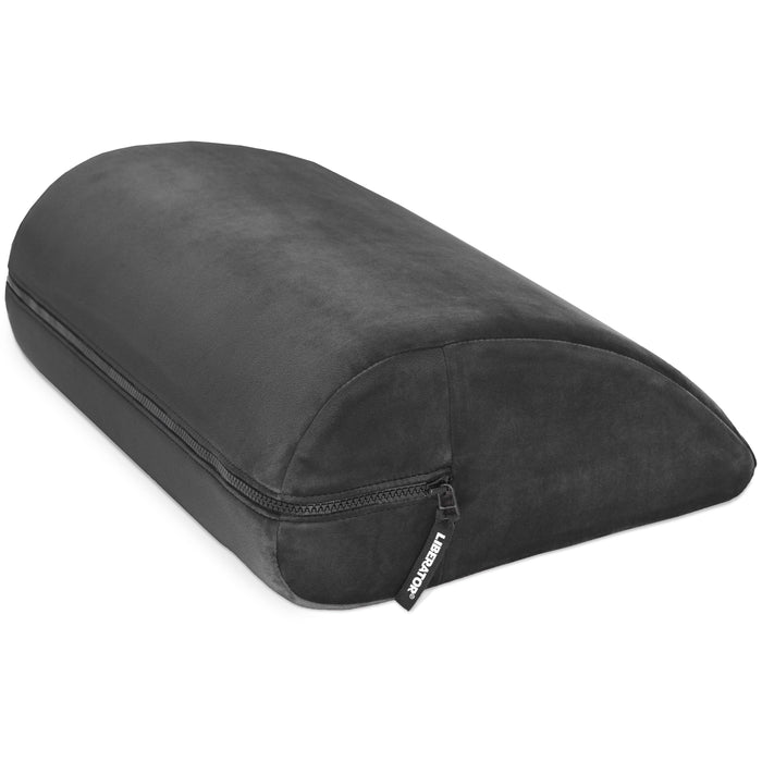The Liberator Jaz Motion – Dual-Sided Rocking Positioning Cushion is a black, wedge-shaped memory foam pillow with a zippered removable cover, providing rocking support. Shown on a white background.
