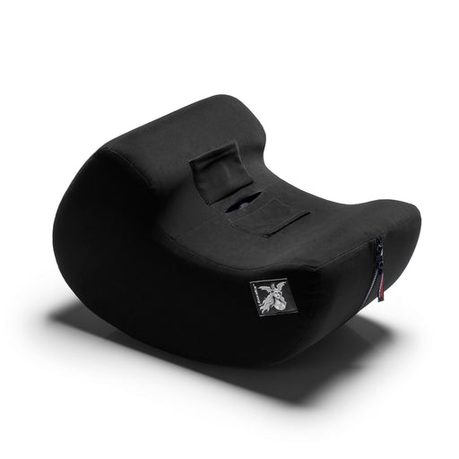 The Liberator Pulse – Ergonomic Straddling Toy Mount is a black, curved pillow with a small side zipper and a white embroidered logo patch on the front, inspired by Liberator furniture and displayed on a white background.
