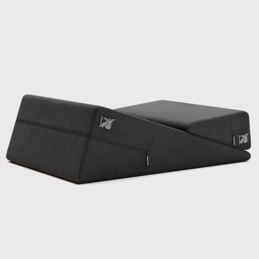 The Liberator Wedge and Ramp Combo Sex Positioning Cushions XL (30”) is a black, wedge-shaped pillow with a zippered cover and butterfly logo, designed for comfort and enhanced support during intimacy.